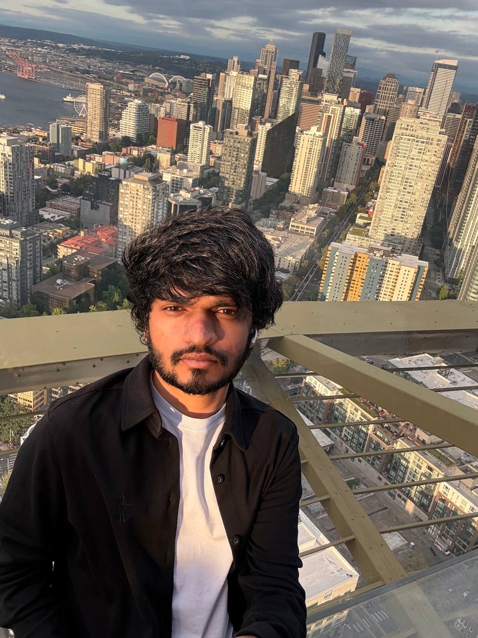 Khush Patel at the Space Needle observation deck above the Seattle skyline